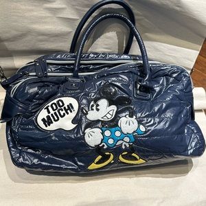 bag with many pockets and the logo of an evil Mickey Mouse
